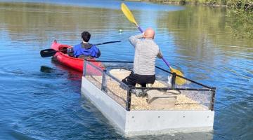 tern nesting raft being towed to anchor the raft in a suitable spot